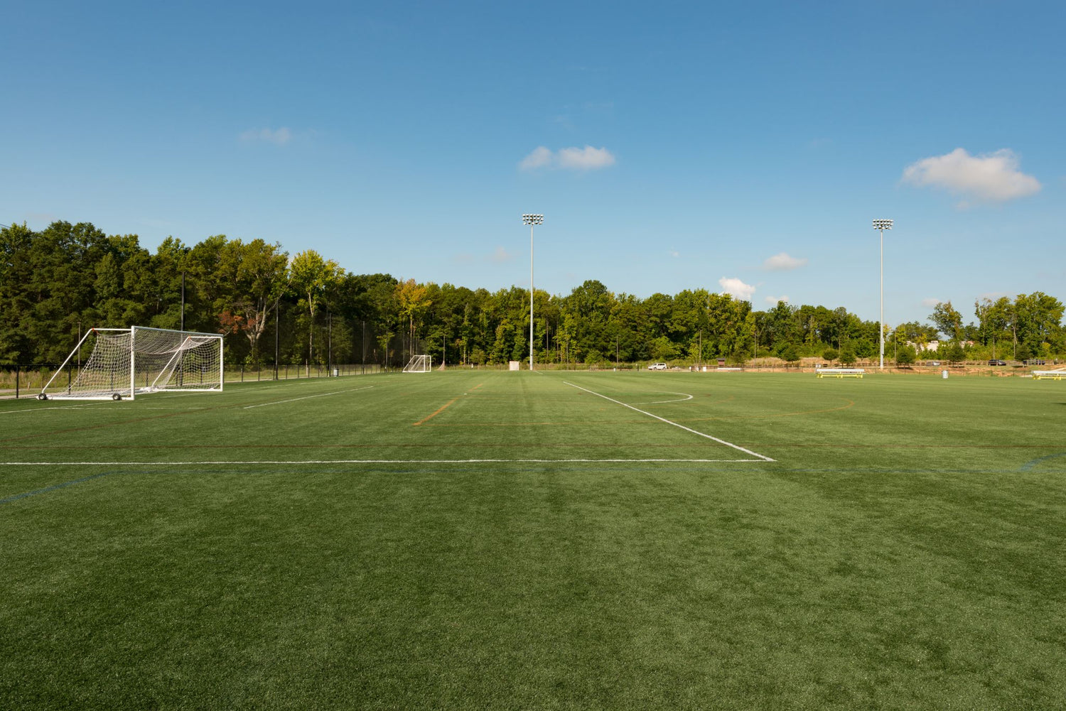 Well-maintained soccer field with goalposts and field markings, showcasing the ideal results of Lifetyme Pro Turf Athletic Kwik Green grass seed