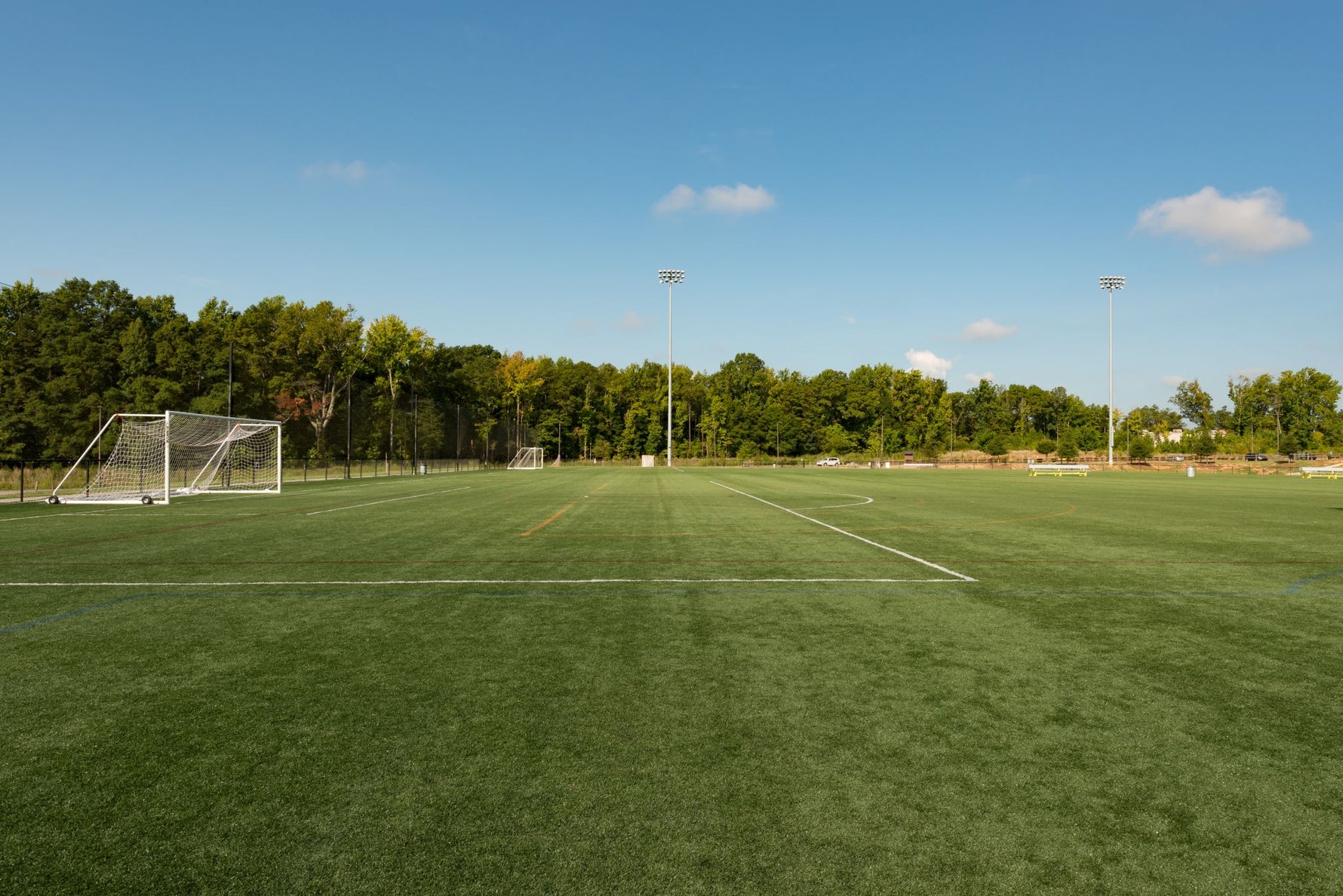 Well-maintained soccer field with goalposts and field markings, showcasing the ideal results of Lifetyme Pro Turf Athletic Kwik Green grass seed