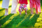 Family walking barefoot on a lush dense green lawn, showcasing the ideal results of Lifetyme BluBlend Kentucky Bluegrass Blend grass seed